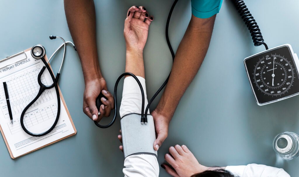 Nurse measuring patient blood pressure